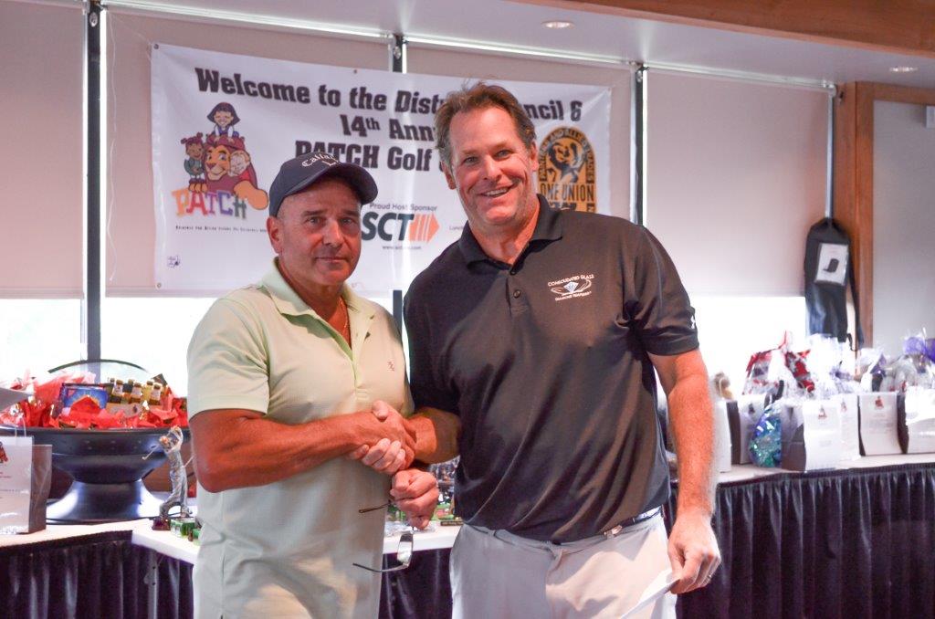 Jim Sherwood, Business Manager Secretary/Treasurer for DC6, presents Louis Merryman, President of Consolidated Glass, a PATCH Check for the New Castle, PA YMCA.