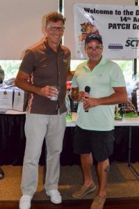 Former Browns Player Tom Cousineau (left), addresses the crowd at the banquet.